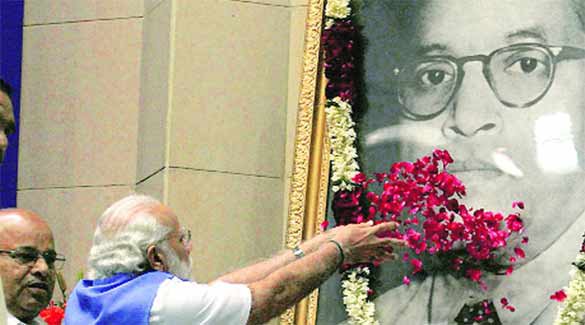 Is just garlanding of portraits is honoring Ambedkar?